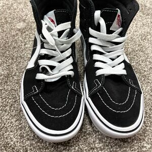 Vans Women’s Black and White High-Top Sneakers